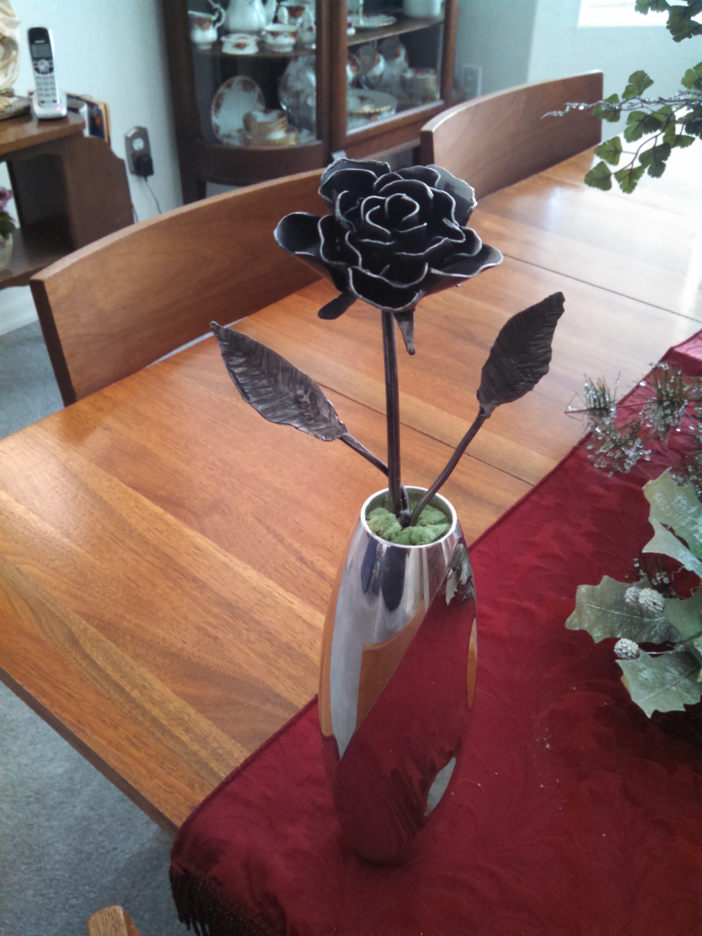 Hand-forged steel rose by Ringing Anvil Design